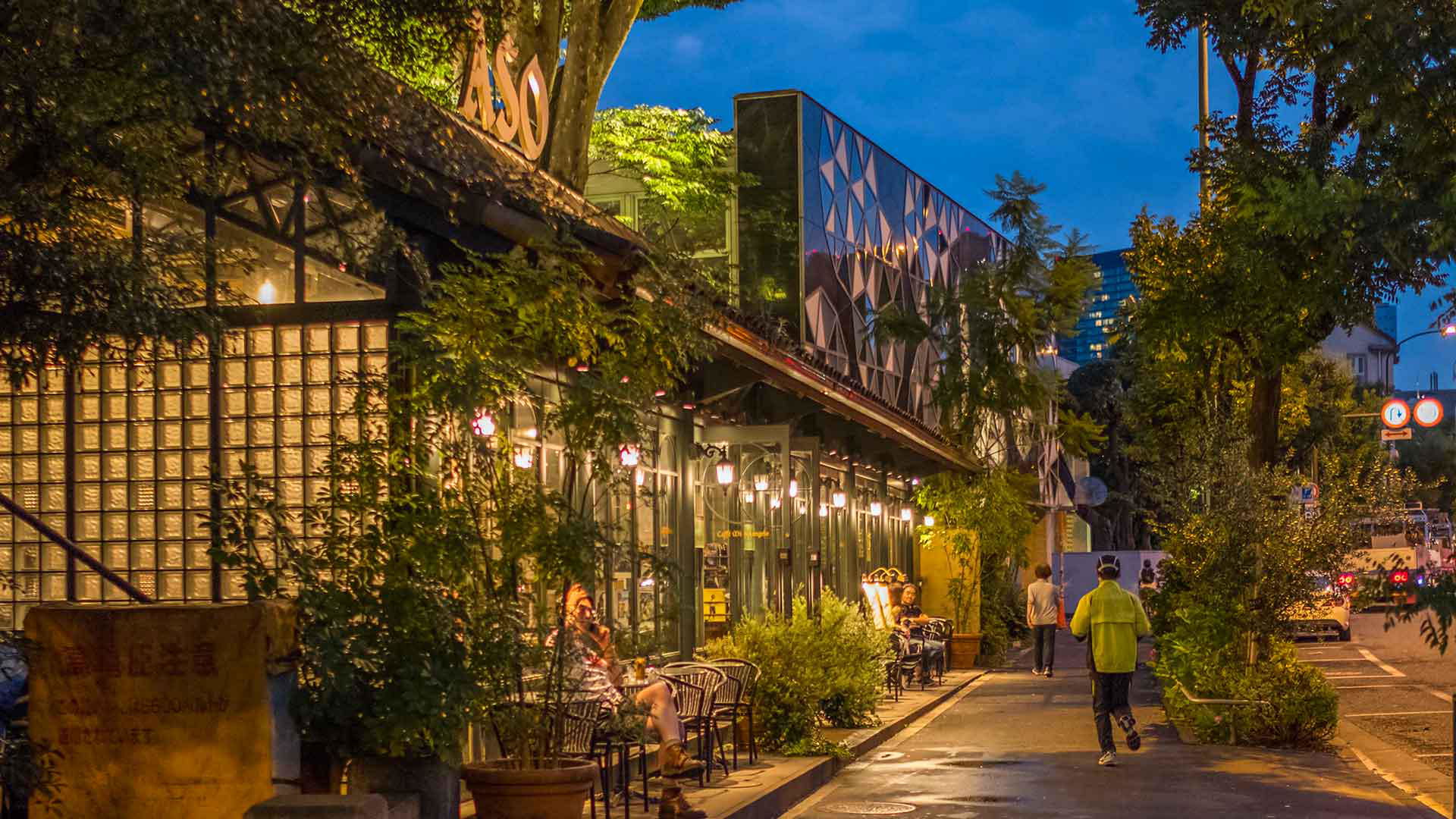 Charming nighttime streetscape with cozy outdoor seating