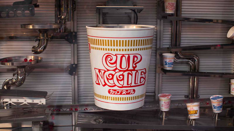 Giant Cup Noodle display in industrial setting