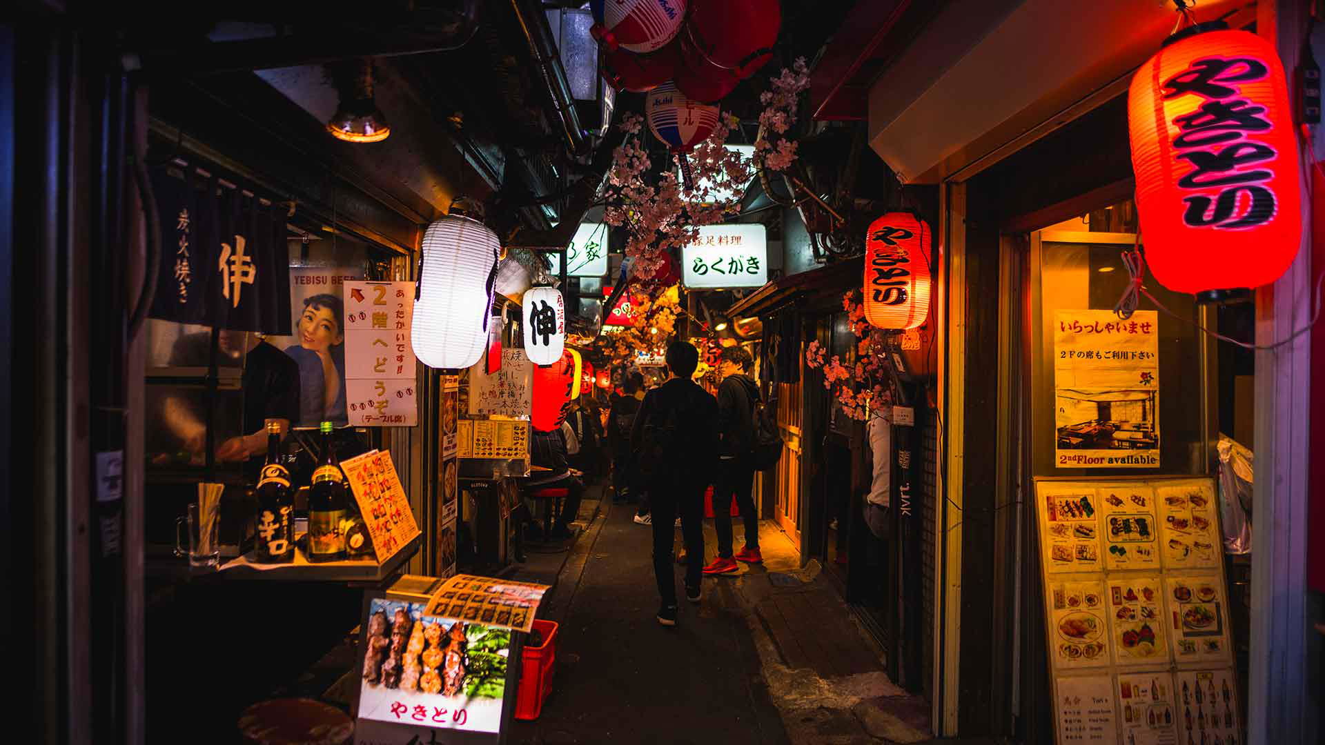 Bustling Tokyo alleyway with vibrant lanterns and street food stalls
