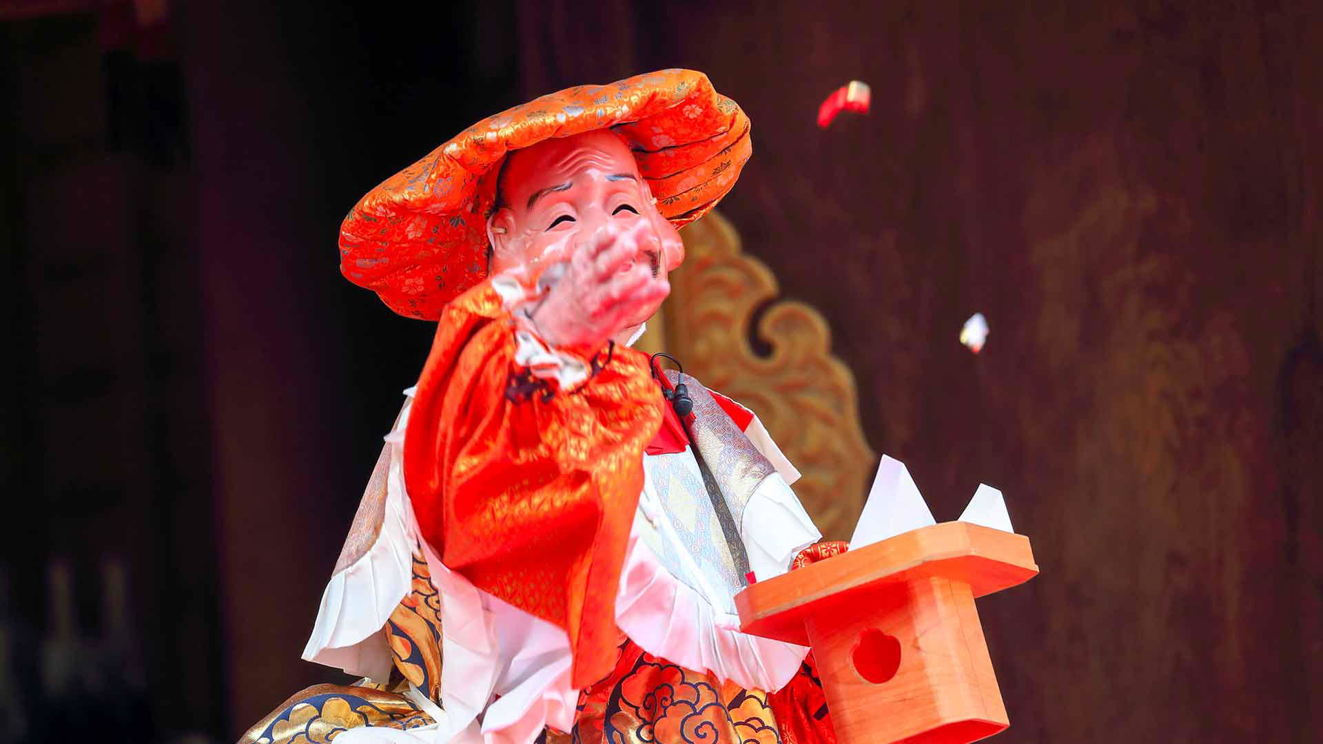 Traditional Japanese festival performer in vibrant costume