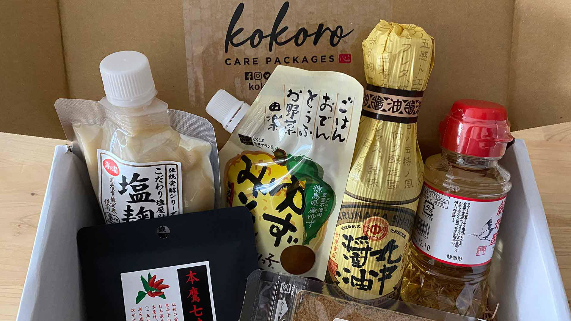 Assorted Japanese condiments in a Kokoro Care package box